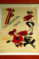 Flour sack embroidered with poppies to remember 1915 at Hoover Museum. West Branch, IA.