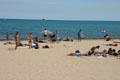 Sun bathers at Oak Street Beach. Chicago, IL.