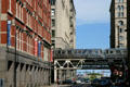 CTA rapid transit train passes over streets of Chicago on elevated loop. Chicago, IL.