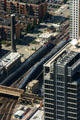 Commuter trains move through canyons of Chicago from Sears Tower. Chicago, IL.
