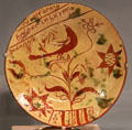 Redware plate painted with bird in tree from Southeastern PA at Art Institute of Chicago. Chicago, IL.
