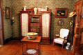 Reception room with bookcase in recreated Wichita Cottage at Sedgwick County Historical Museum. Wichita, KS.