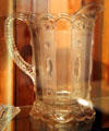 Kansas pressed glass pitcher in Jewel & Dewdrop pattern by United States Glass Co. of Pittsburgh, PA at Sedgwick County Historical Museum. Wichita, KS.