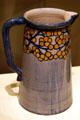 Newcomb Pottery pitcher with yellow-red berries at Shaw Center for the Arts. Baton Rouge, LA.