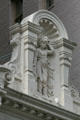 Roofline details of carved woman wearing lion skin on Teutonia Insurance Co. Building. New Orleans, LA.