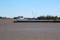 Covered barge rounds Mississippi River at New Orleans. New Orleans, LA.
