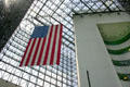 Flag hangs in atrium of JFK Library. Boston, MA.