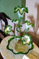 Green & white Victorian glass flower arrangement holder at Rotch-Jones-Duff House. New Bedford, MA.