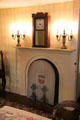 Dining room fireplace with mantle clock at Orchard House. Concord, MA