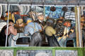Supervisor & workers at car assembly on south wall of Detroit Industry Murals by Diego Rivera at Detroit Institute of Arts. Detroit, MI.