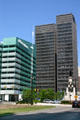 Black 1001 Woodward beside green One Kennedy Square. Detroit, MI.