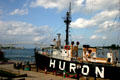 Mast of Huron Lightship Museum against Blue Water Bridge. Port Huron, MI
