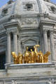 Gold Progress of the State equestrian statues on dome of Minnesota State Capitol. St. Paul, MN.