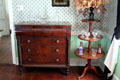 Chest of drawers & glassware on table at General Daniel Bissell House. St. Louis, MO.