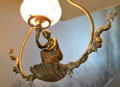 Hall lamp of woman kneeling in sea shell flanked by dolphins at Chatillon-DeMenil Mansion. St. Louis, MO.