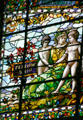 Fraternity panel with woman guiding two young boys to fellowship on Missouri values stained glass window at Missouri State Capitol. Jefferson City, MO.