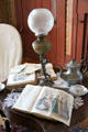 Table lamp & tea pot in sitting room at John Wornall House Museum. Kansas City, MO.