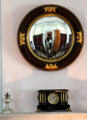 Convex mirror over clock at Beauvoir. Biloxi, MS.