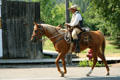 Cowboy riding through town. Virginia City, MT.