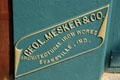 Makers nameplate of Geo. L. Mesker & Co. Architectural Iron Works, Evansville, Ind. on Metropolitan Meat Market building. Virginia City, MT.