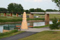 Old rail bridge over Red River & high water flood memorial marker. Grand Forks, ND.