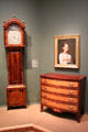 Tall clock by Levi Hutchins, portrait of Sarah Minot Melville by Zedekiah Belknap, & chest of drawers by Joseph Clark of NH at Currier Museum of Art. Manchester, NH.