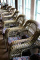 Woven willow craftsman armchairs on sun porch at Stickley Museum at Craftsman Farms. Morris Plains, NJ.