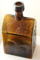 E.G. Booz Old Cabin Whiskey amber bottle by Whitney Glass Works of Glassboro, NJ at Museum of American Glass. Milville, NJ.