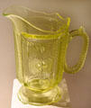 Vaseline or Uranium glass medallion water pitcher by unknown at Museum of American Glass. Milville, NJ.