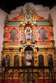 La Conquistadora Chapel with Our Lady of the Rosary on reredos with saints in St. Francis Cathedral. Santa Fe, NM.