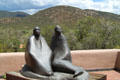 Dineh sculpture by Allan Houser against surrounding hills at Wheelwright Museum of the American Indian. Santa Fe, NM