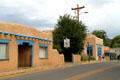 Adobe-style heritage buildings with blue trim. Taos, NM.