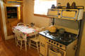 Kitchen stove & table in Blumenschein Home & Museum. Taos, NM.