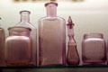 Antique glass bottles turned purple at Nevada State Museum. Carson City, NV.