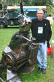 Artist with automotive sculpture at Art on Wheels Fair. Buffalo, NY.