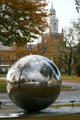 Reflective sculpture at Albright-Knox Art Gallery against tower across street. Buffalo, NY.