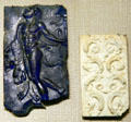 Roman glass plaques of Satyr & foliage at Corning Museum of Glass. Corning, NY.