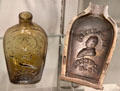 American glass liquor flask with image of Lafayette & metal mold in which it was blown at Corning Museum of Glass. Corning, NY.