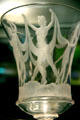 Detail of Steuben engraved glass goblet with dancing nudes at Corning Museum of Glass. Corning, NY.