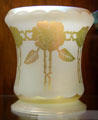 White glass vase with enameled gold roses by Frederick Carder for Steuben Glass at Corning Museum of Glass. Corning, NY.