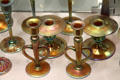 Gold Aurene glass candlesticks by Frederick Carder for Steuben Glass at Corning Museum of Glass. Corning, NY.