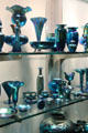Examples of Blue Aurene by Frederick Carder made by mixing glass with cobalt at Corning Museum of Glass. Corning, NY.
