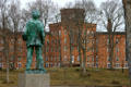 Sculpture of Mark Twain looks over Cowles Hall at Elmira College. Elmira, NY.
