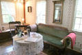 Sitting area with settee in front room at Millard Fillmore House. East Aurora, NY.
