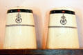 Ceramic salt & pepper shakers with Roycroft logo from Roycroft Inn at Elbert Hubbard Roycroft Museum. East Aurora, NY.