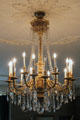 Crystal chandelier hanging from ornate plasterwork in East Room at Eastman House. Rochester, NY.