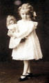Vintage photo of young Margaret Woodbury Strong holding her doll at The Strong National Museum of Play. Rochester, NY.