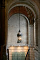 Lamp hangs in stairwell of New York Public Library. New York, NY.