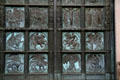 Bronze doors of St John the Divine with evangelistic symbols in bottom row. New York, NY.