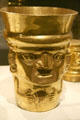 Lambayeque gold beaker of figure with shell from Peru at Metropolitan Museum of Art. New York, NY